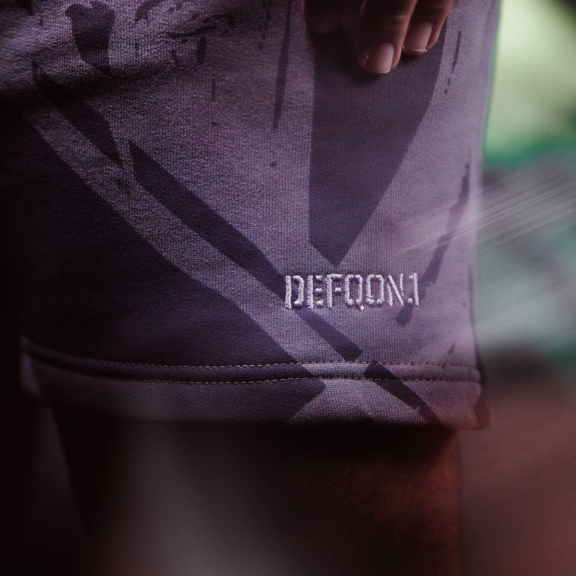 Close-up of a purple Defqon.1 shorts with a blurred background